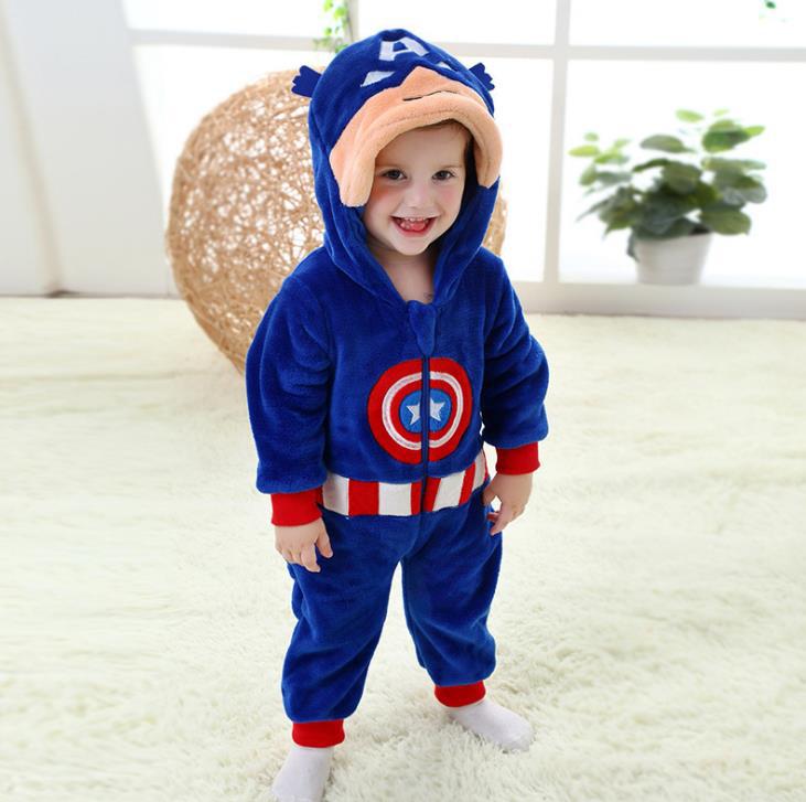 Baby jumpsuit costume in blue with red cuffs and striped waistband, child in a hooded superhero outfit.