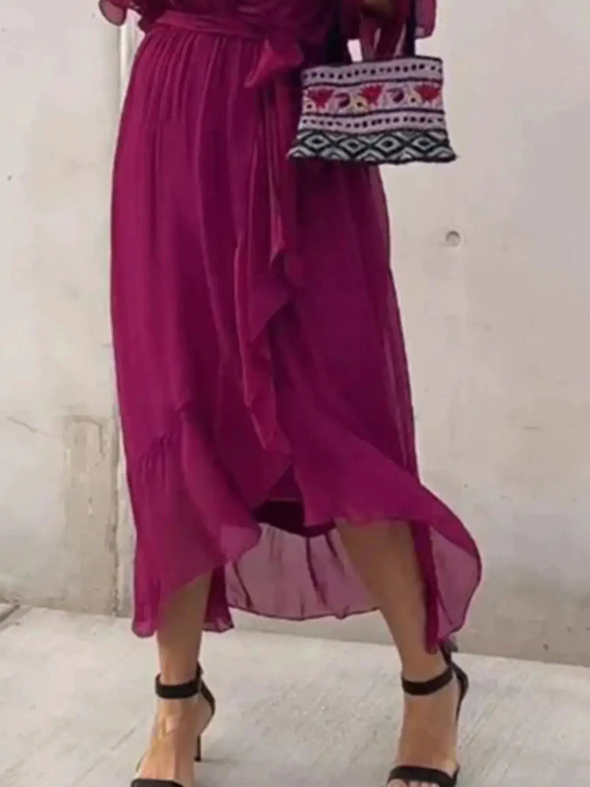 Plus-size magenta flowy tie-front midi dress with flutter sleeves; patterned handbag visible beside it (2 items).