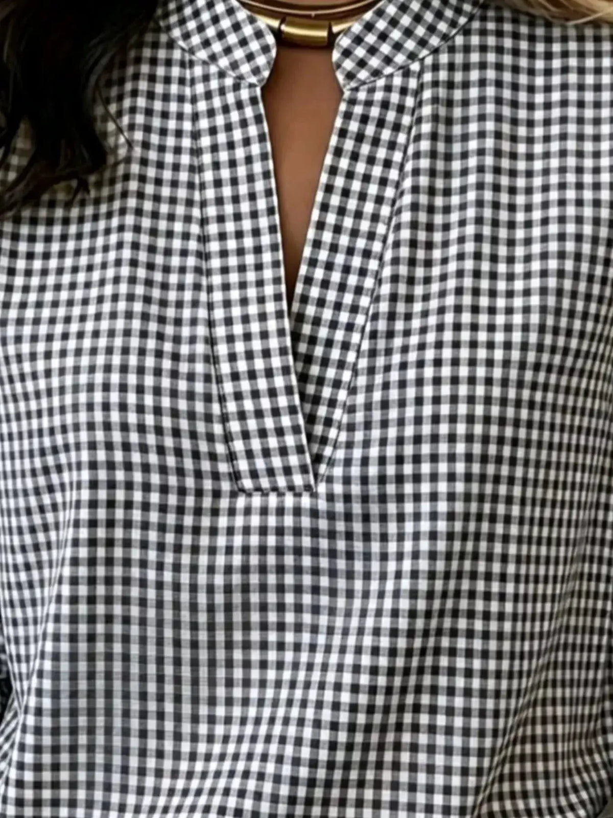 Plus-size plaid notched long-sleeve blouse in black and white gingham by Trendsi