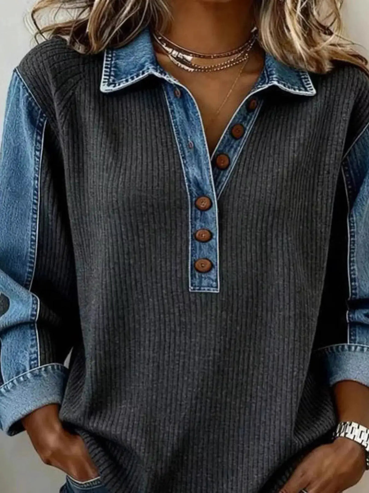 Denim Trim Button Detail Sweatshirt with dark ribbed knit body, blue denim placket and collar, brown buttons