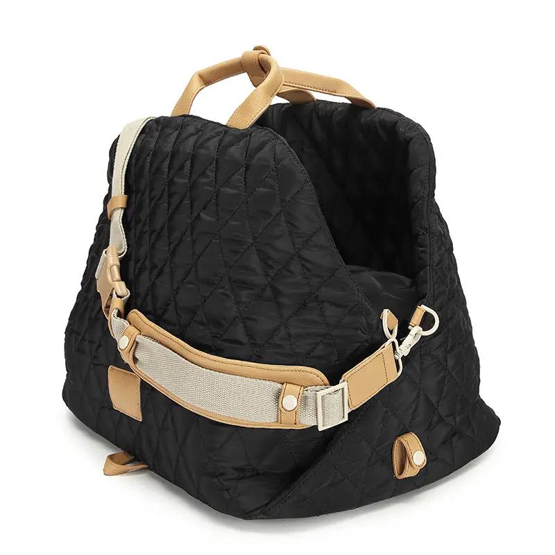 AdTec pet handbag cat carrier, black quilted fabric with tan faux leather trim and beige strap