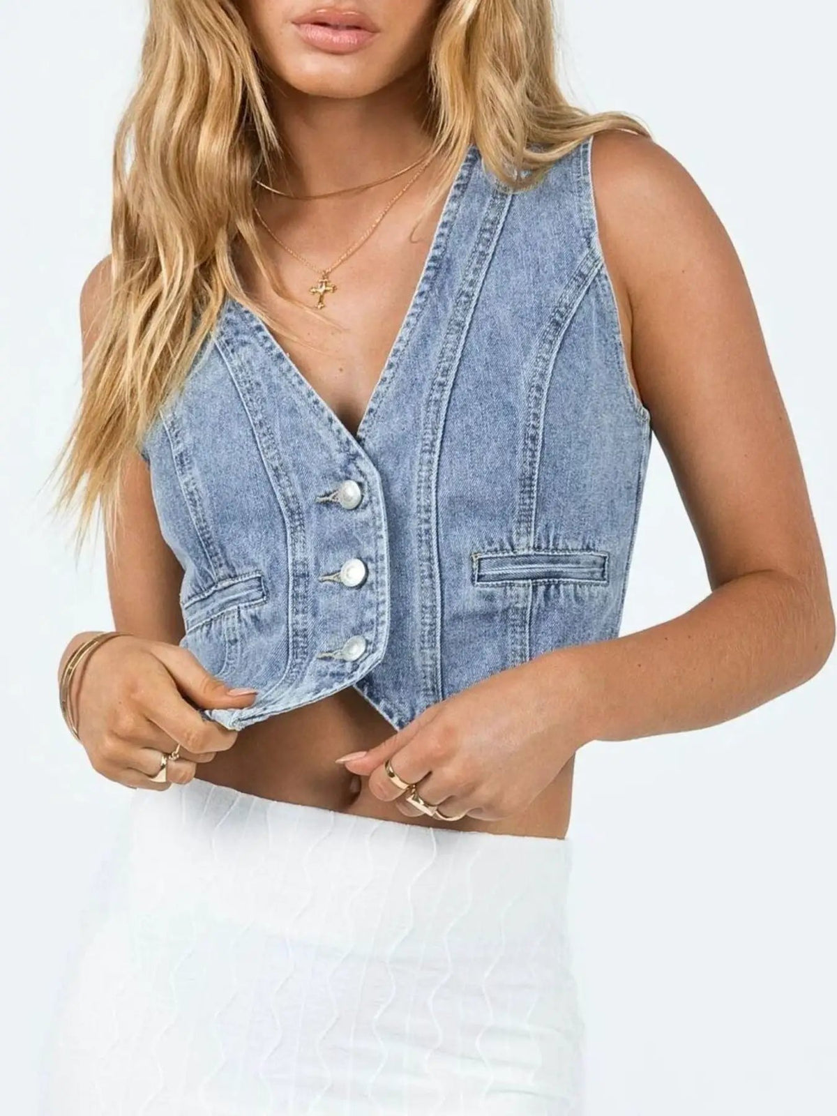 V-neck light-wash denim vest with pearl-button front, sleeveless design and twin welt pockets, Trendsi
