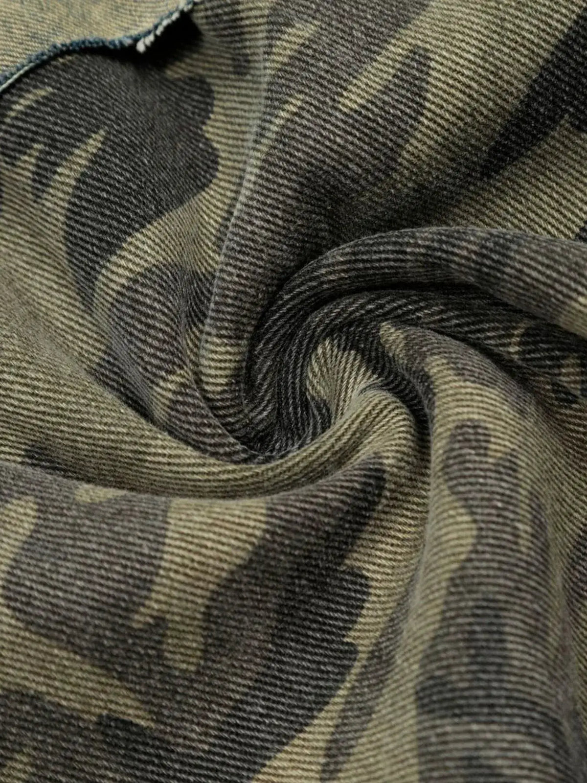 Men's distressed camo patchwork denim shorts, relaxed fit in olive and tan tones