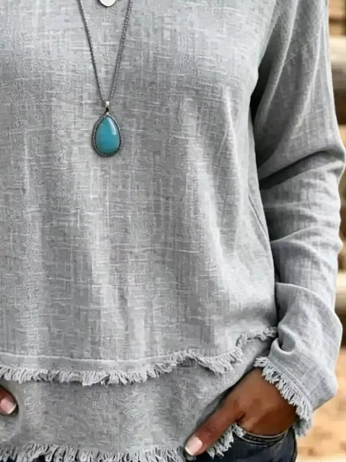 V-Neck Frayed Hem Long Sleeve T-Shirt by Trendsi, heather gray.