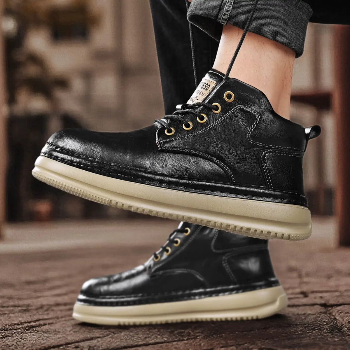 Pair of Meridian microfiber mid-top boots by AdTec, black with beige chunky mid-heel sole