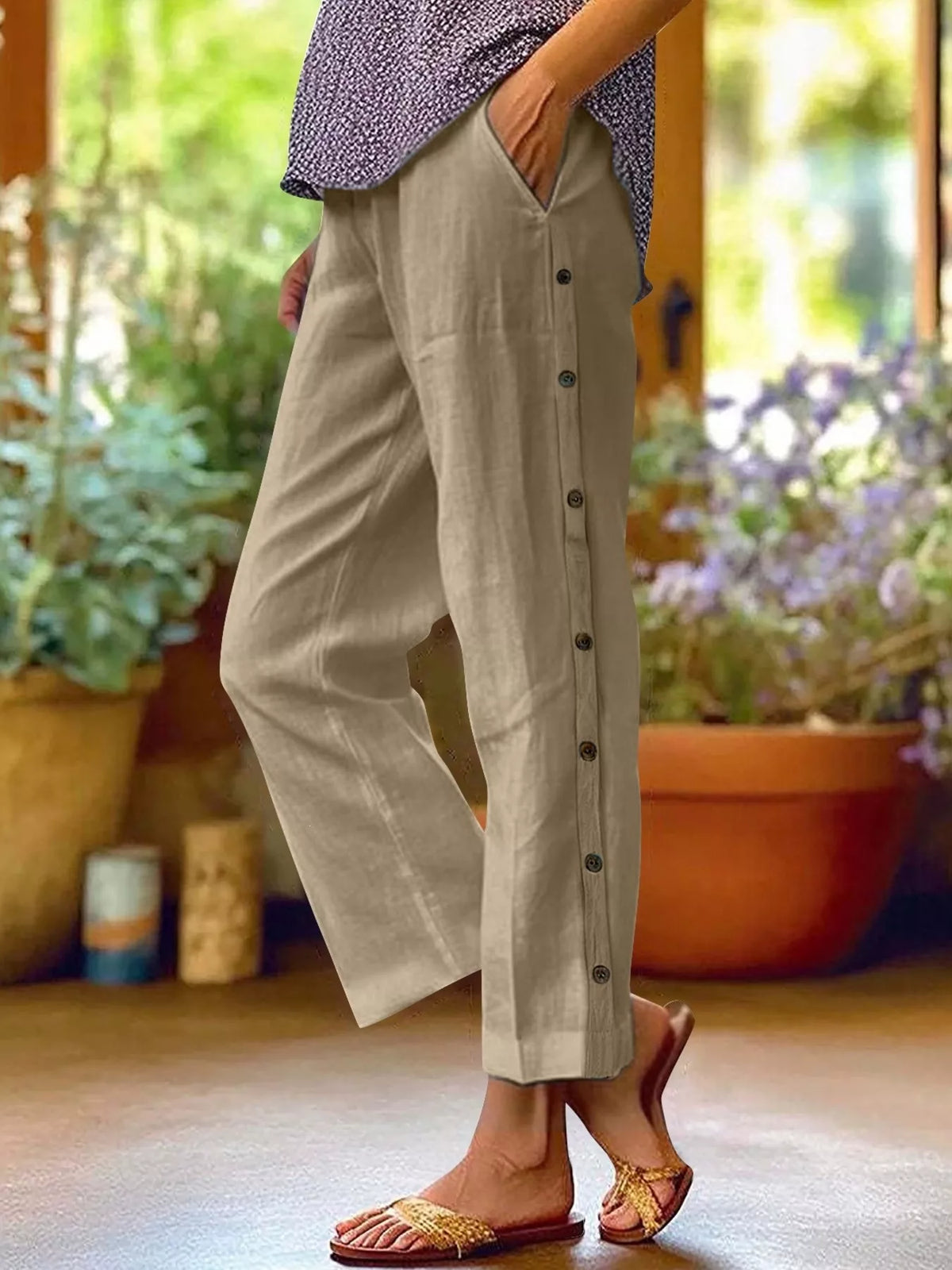 Plus-size beige wide-leg pants with side-button decor and pockets