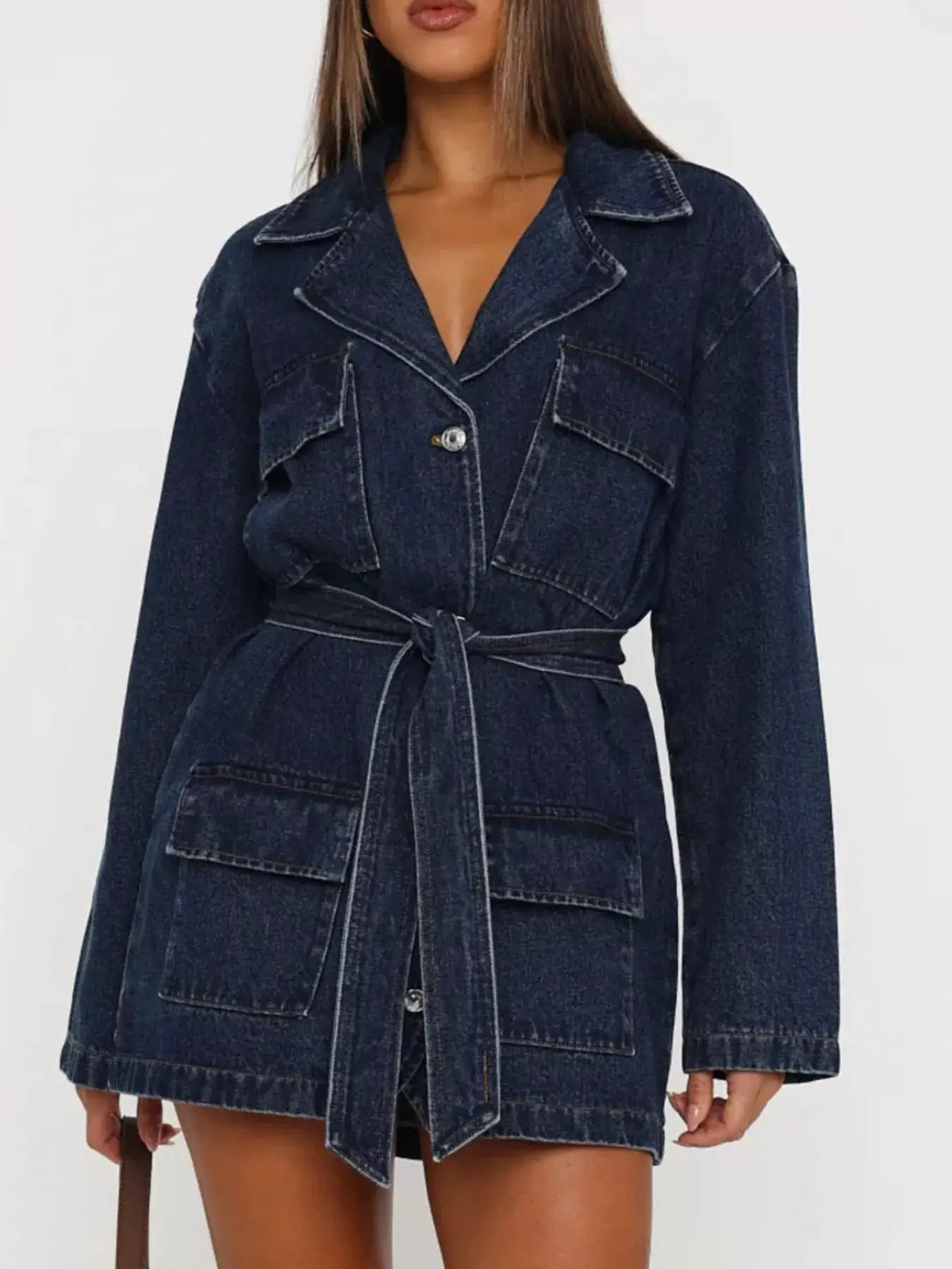 Longline washed denim jacket with matching belt in dark indigo denim; front pockets and wide lapels.