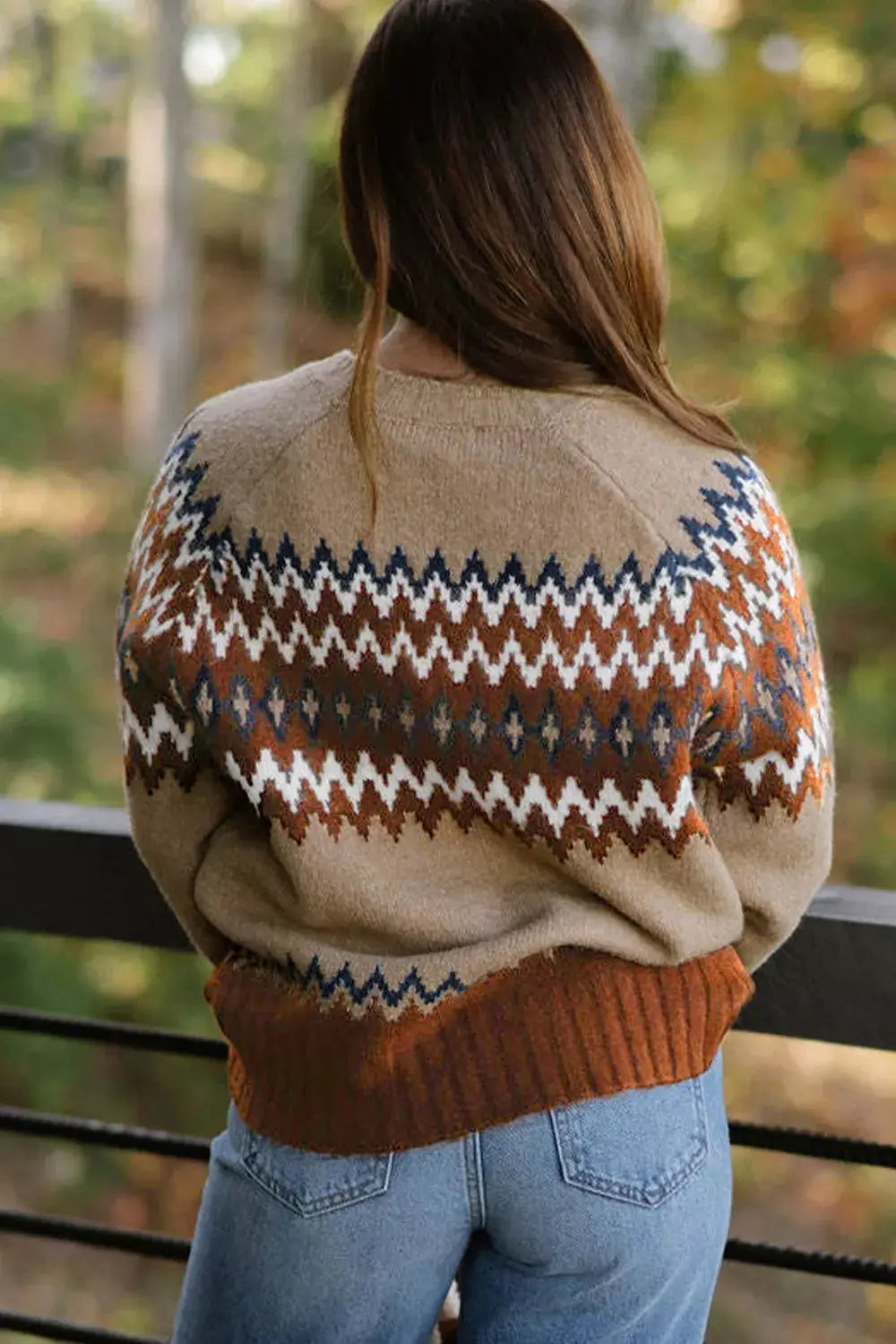 Geometric pattern long sleeve sweater in beige with rust, navy, and white zigzag design.