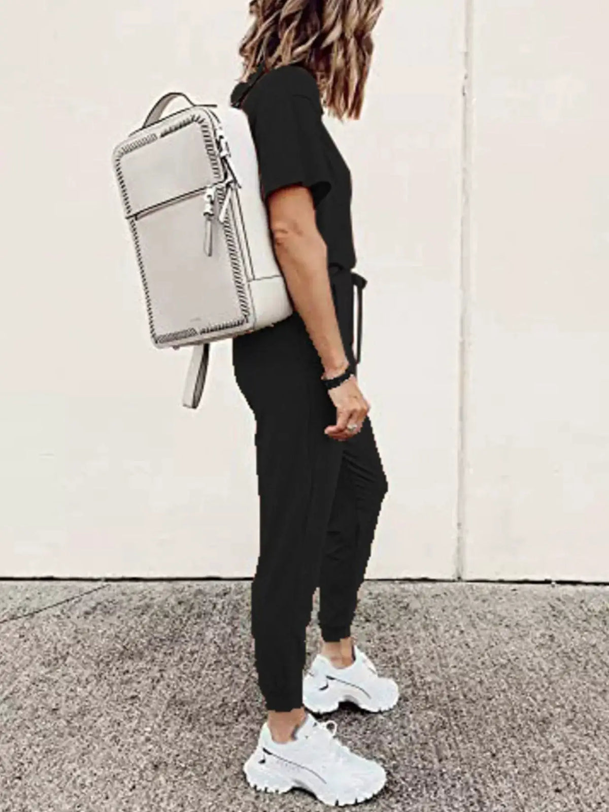 Trendsi plus-size round-neck top and drawstring pants set in black worn by model