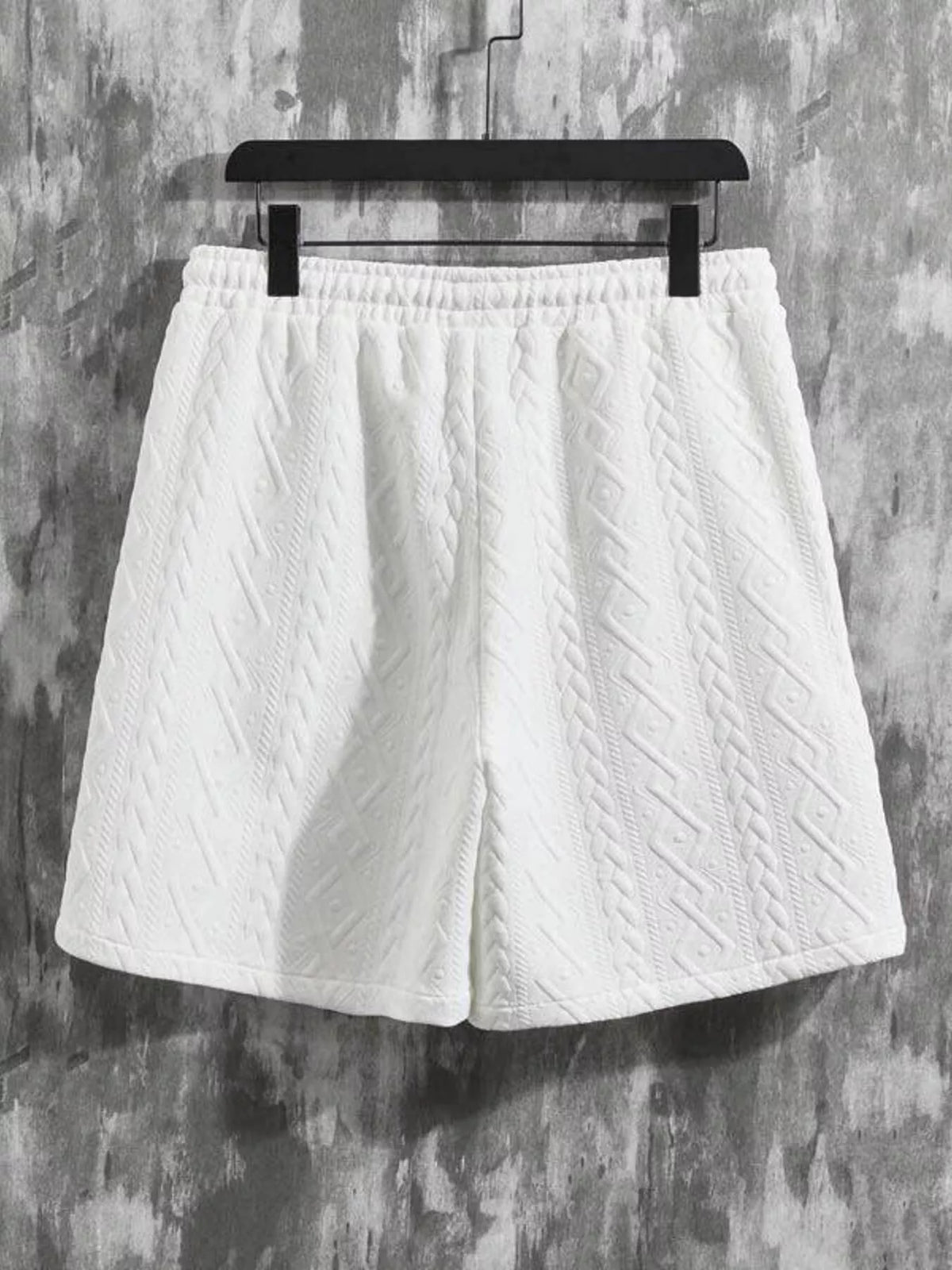 Men's white textured knit shorts with elastic waistband and cable pattern