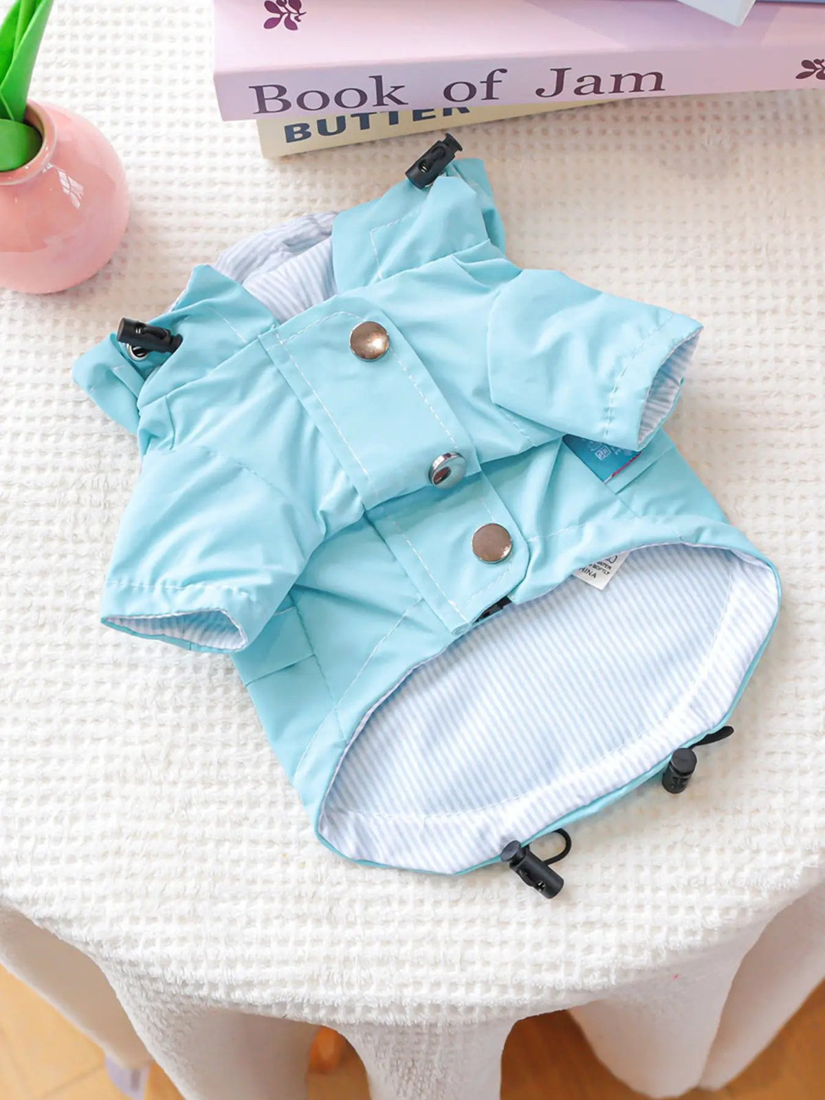 Lightweight waterproof pet raincoat in light blue with striped lining by Trendsi