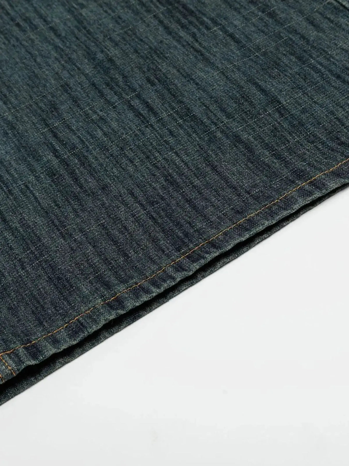 Mens relaxed-fit denim shorts in dark indigo cotton blend with orange stitching along hem.