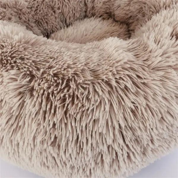 Round plush cat bed with long beige-brown fur, nest pad style for cozy winter warmth
