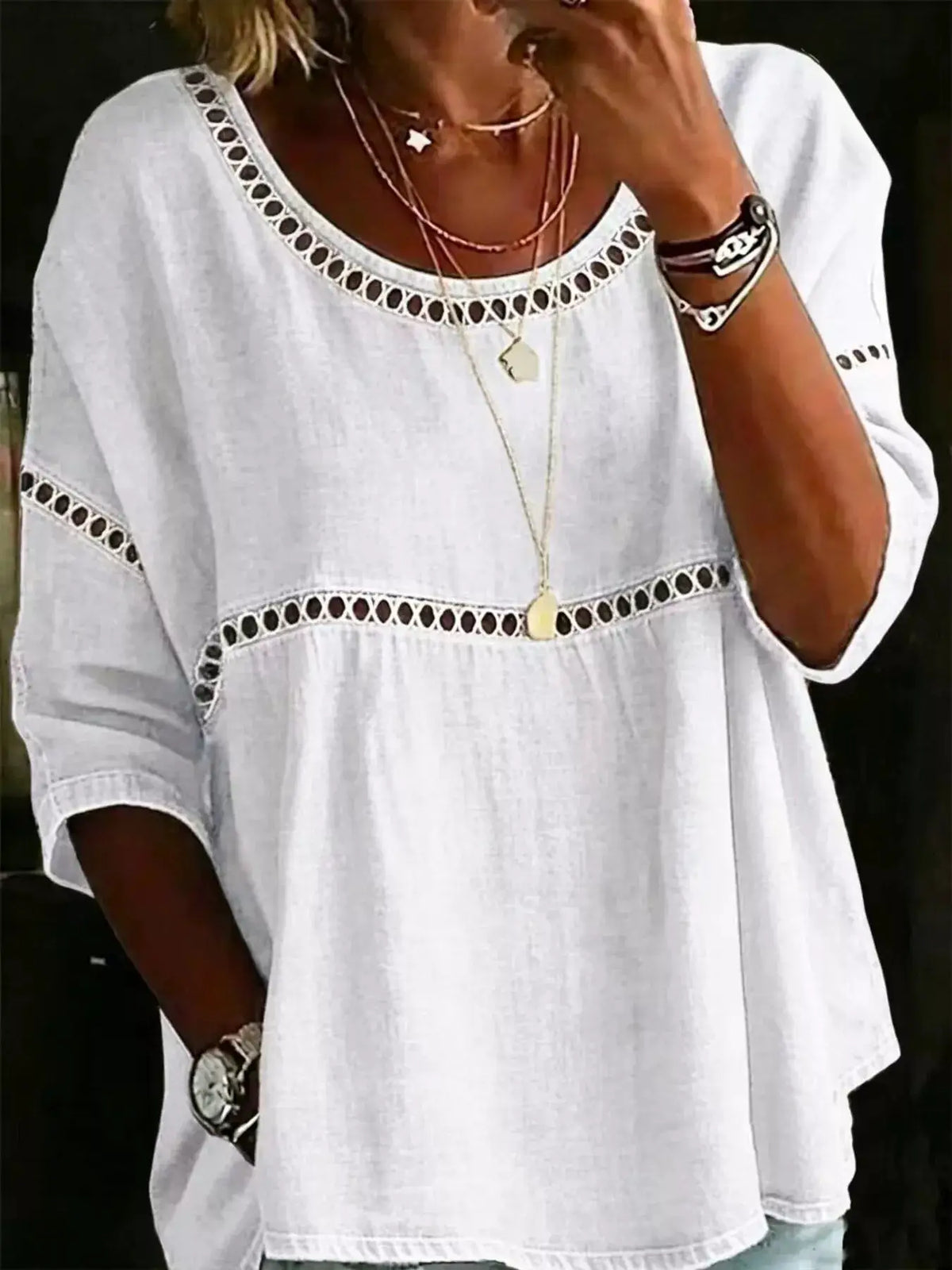 Plus-size white hollow-out round-neck top with eyelet trim by Trendsi.