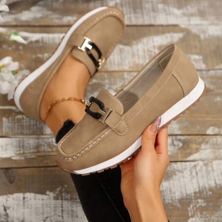 Round Toe Buckle Detail Slip-Ons: taupe suede with white sole; two shoes shown.