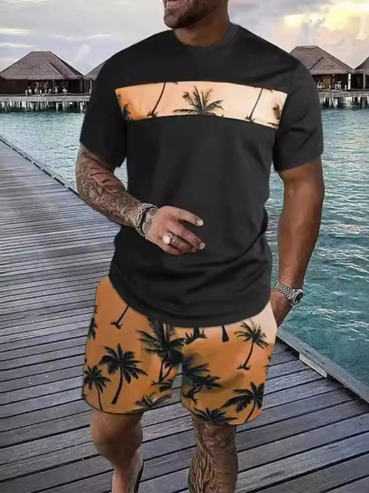 Trendsi Mens tropical palm tee and shorts set; black tee with tan palm stripe, orange palm-print shorts