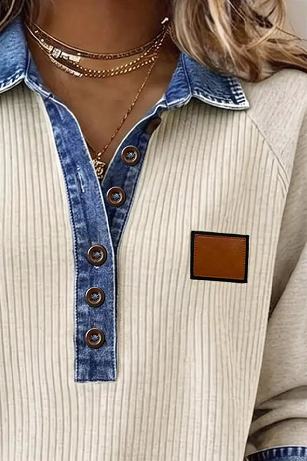 Stretchy ribbed knit button-front top with contrast denim trim, beige body, brown buttons, leather patch