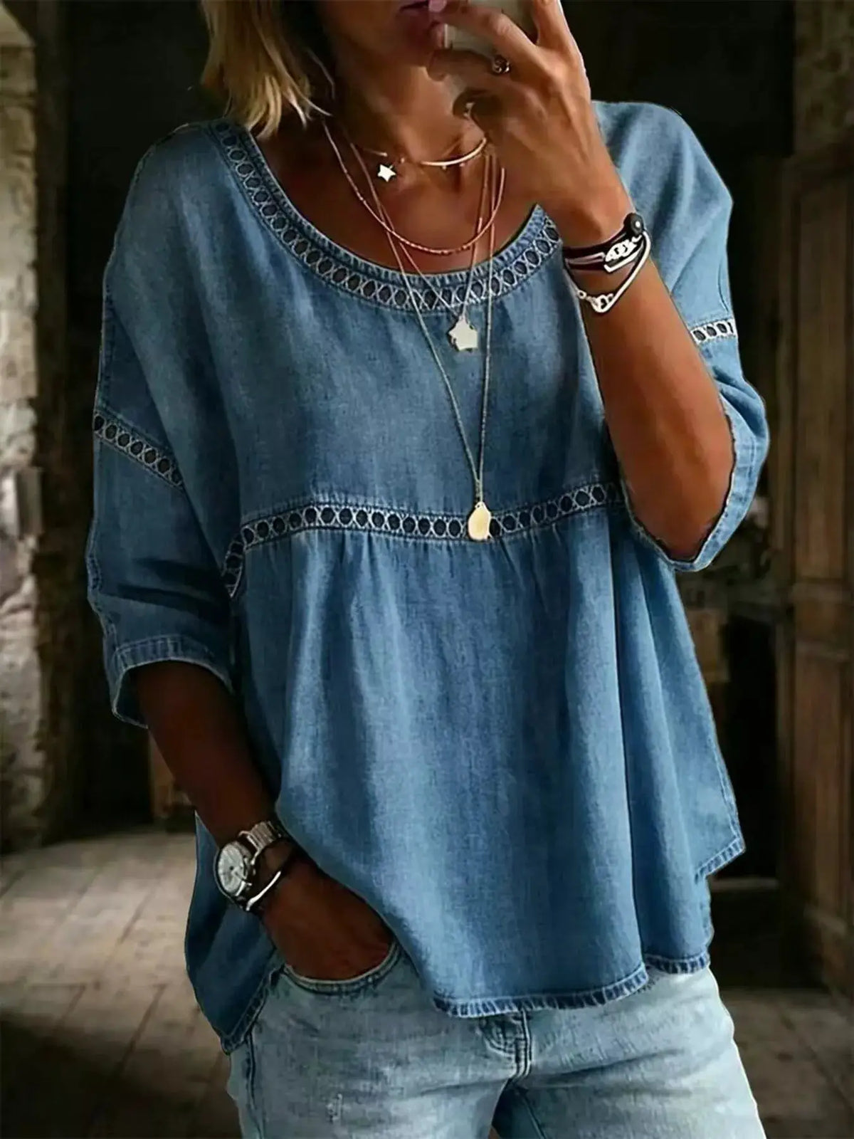 Plus-size hollow-out round-neck denim top in blue with decorative openwork trim