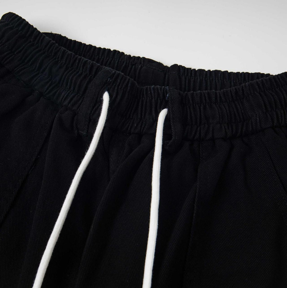 Cartoon embroidery workwear pants, black jeans with elastic waist and white drawstrings