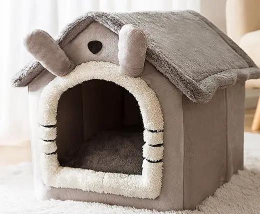 Foldable dog house bed in soft gray plush with white faux fur trim, heart entrance, enclosed cave interior.