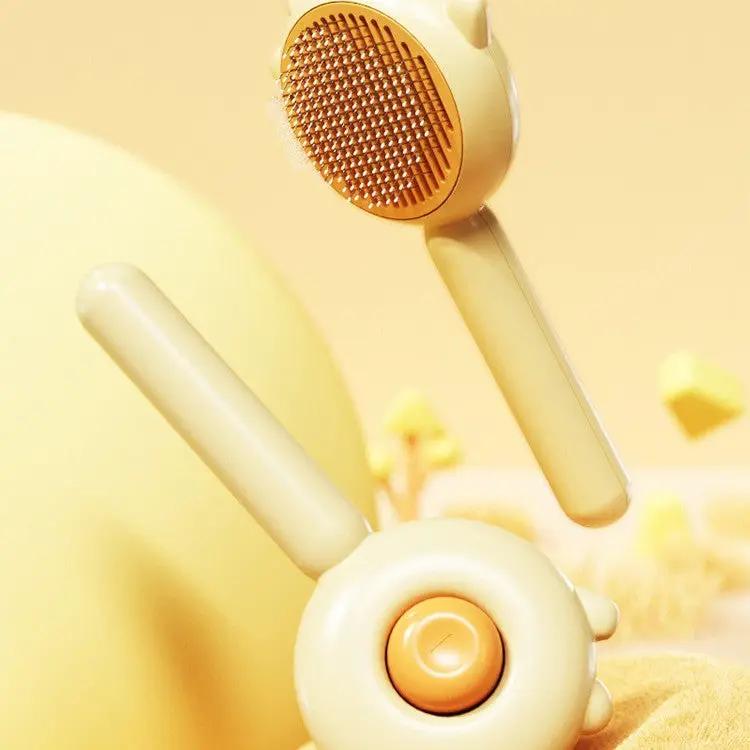 AdTec Cat Grooming Massage Brush in yellow with bristle head for hair removal
