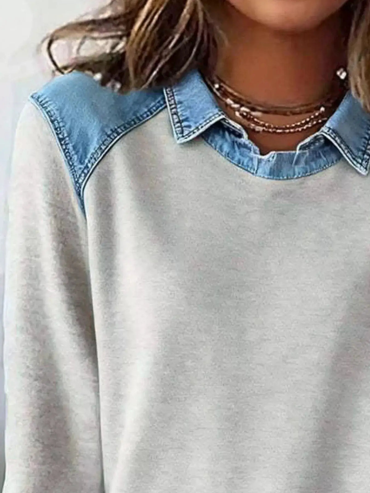 Classic plus-size long-sleeve top with blue denim collar trim on light gray fabric