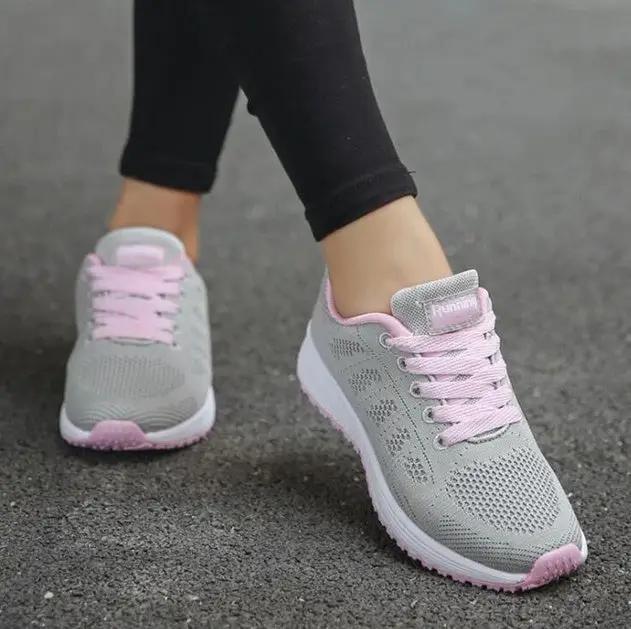 AdTec women's sport sneakers in gray mesh with pink laces and accents.