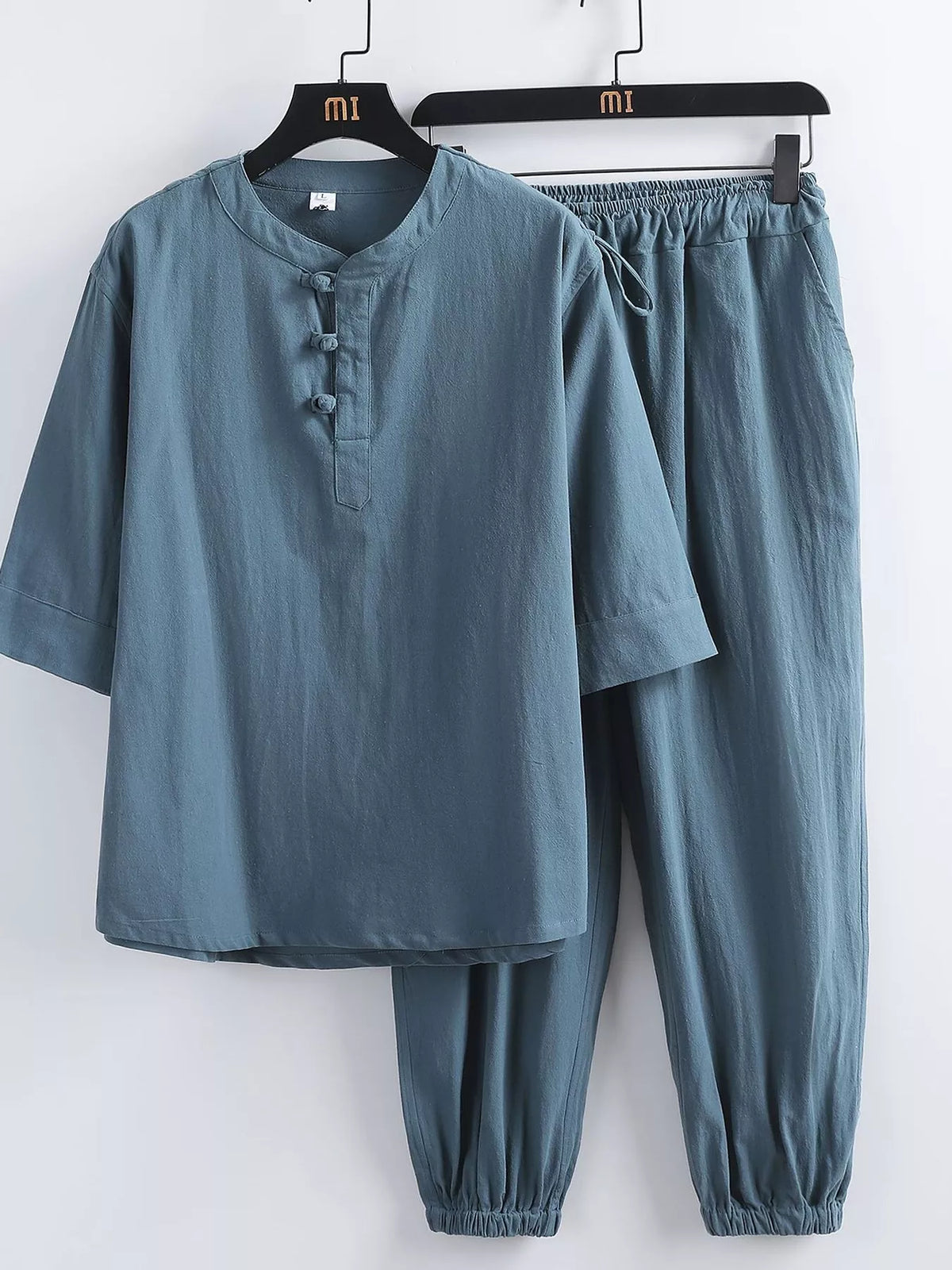 Men's plus-size 3/4 sleeve top and pants set by Trendsi in teal with mandarin collar and knot-button placket