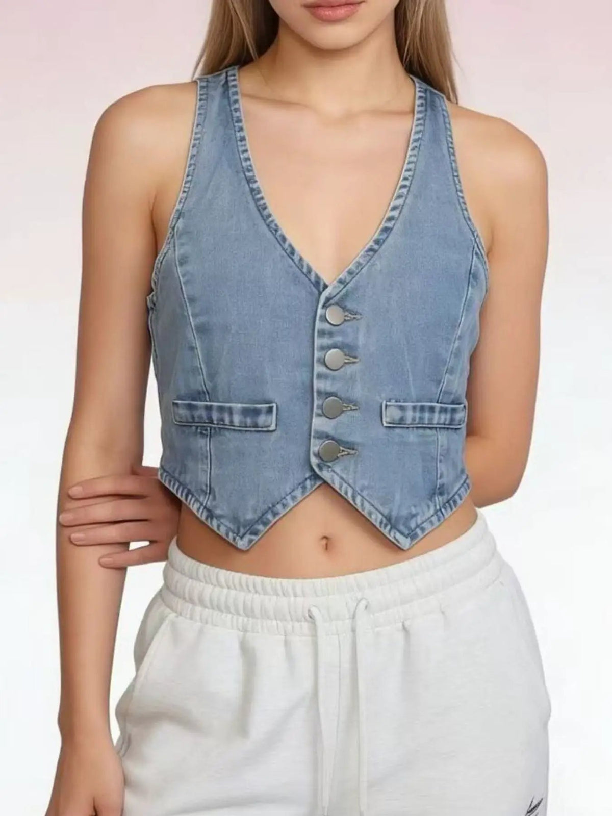 Classic Button-Down Denim Vest in light blue cotton blend, sleeveless with a button-front and cropped hem.
