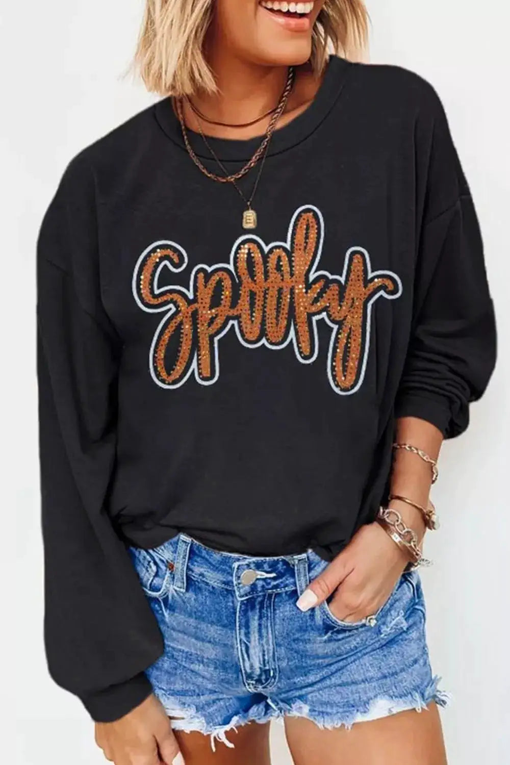 Spooky rhinestone drop-shoulder sweatshirt in black with orange sequin lettering