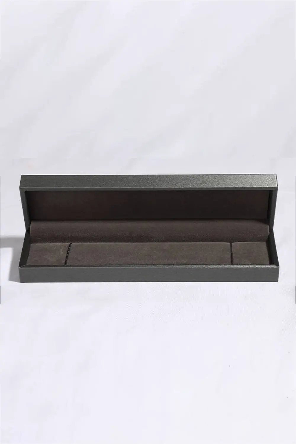 Bracelet, 10 Carat Moissanite Platinum-Plated, in a dark gray jewelry box with brown interior.