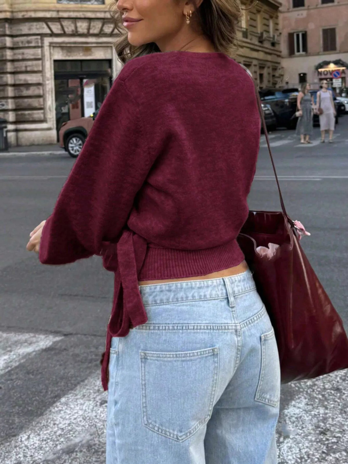 Women's burgundy tie-waist surplice knit sweater with soft stretch fabric, by Trendsi