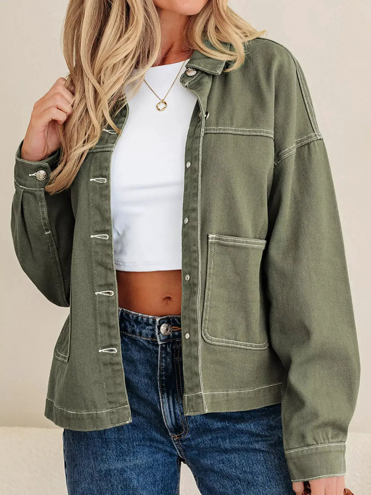 Boyfriend denim jacket in olive green with patched front pockets and button closure