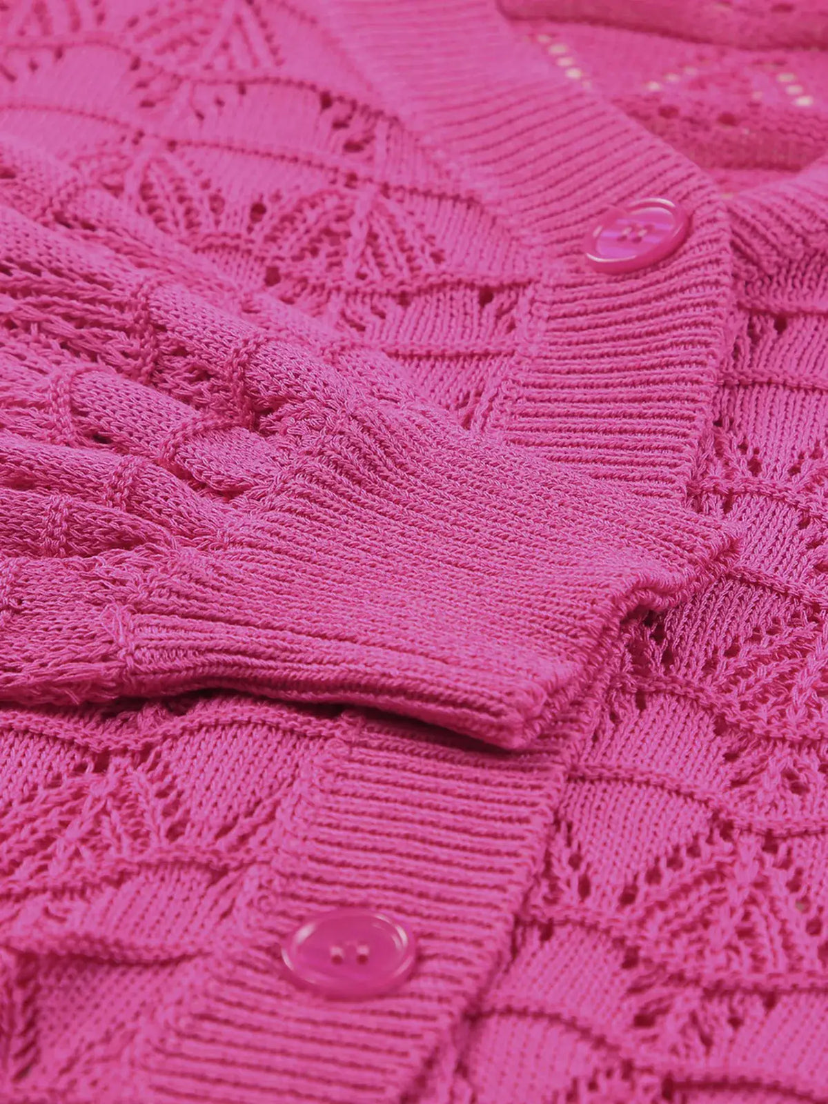 Button-front pink openwork cardigan with textured stretch knit.
