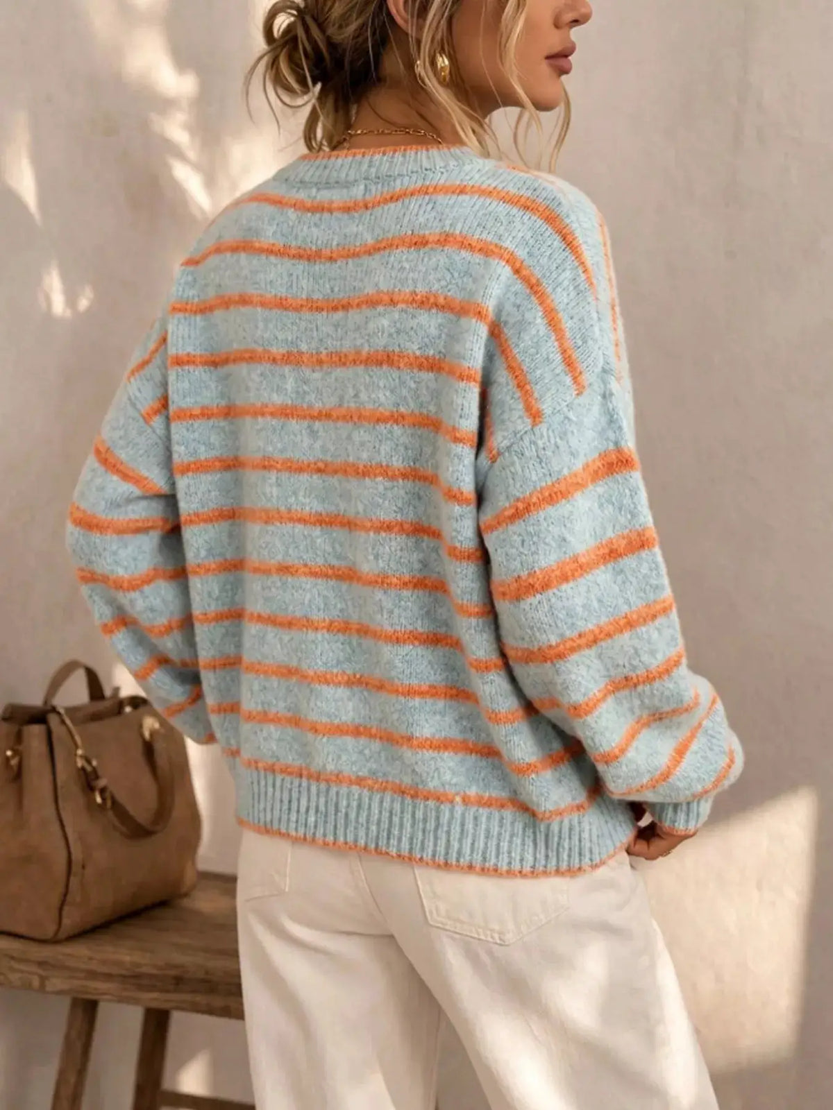 Striped Button-Down Knit Cardigan in light blue with orange stripes; knit texture, back view, relaxed oversized fit.
