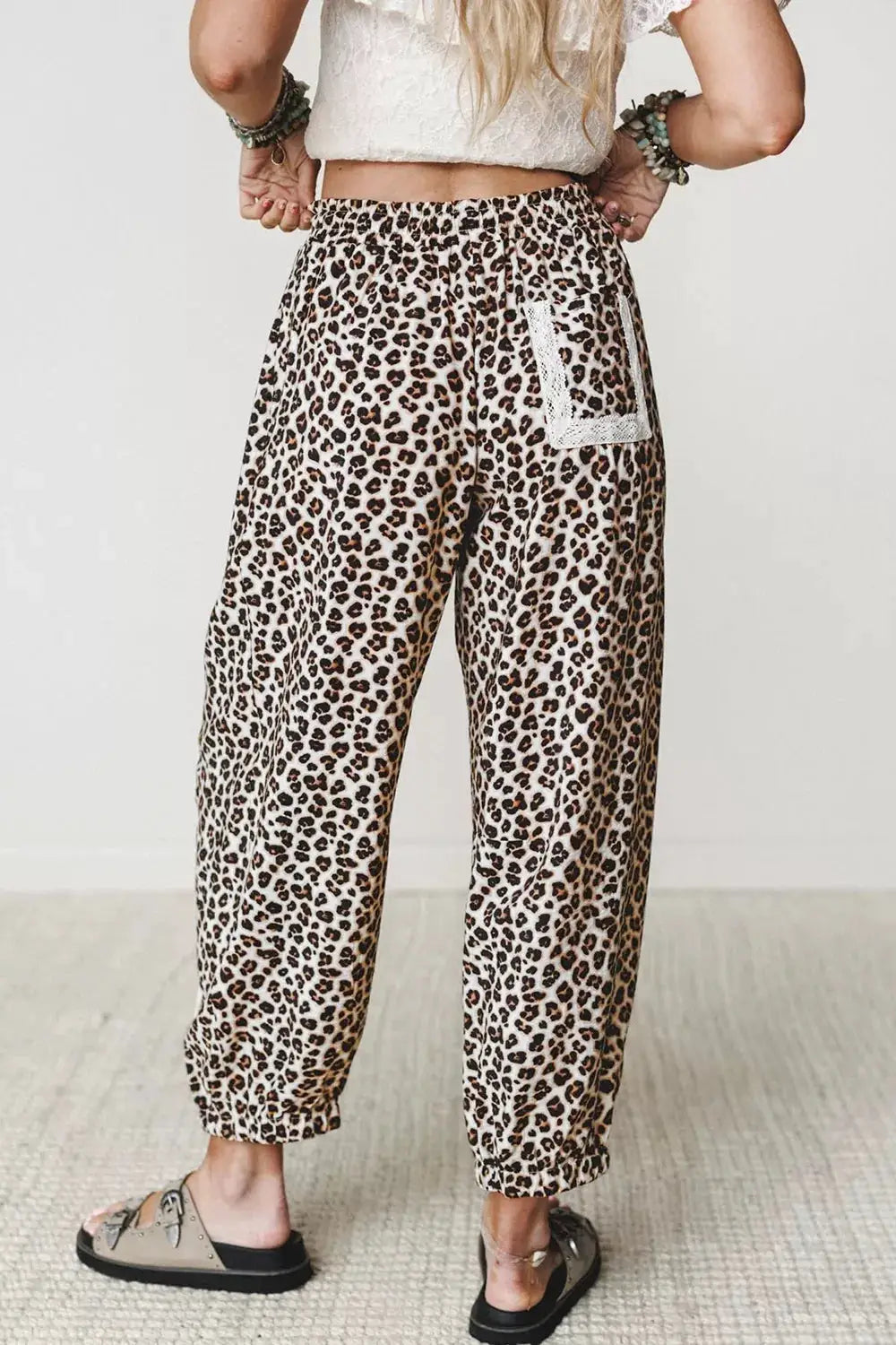 Leopard print ankle-length pants with elastic waist and lace-trim back pocket