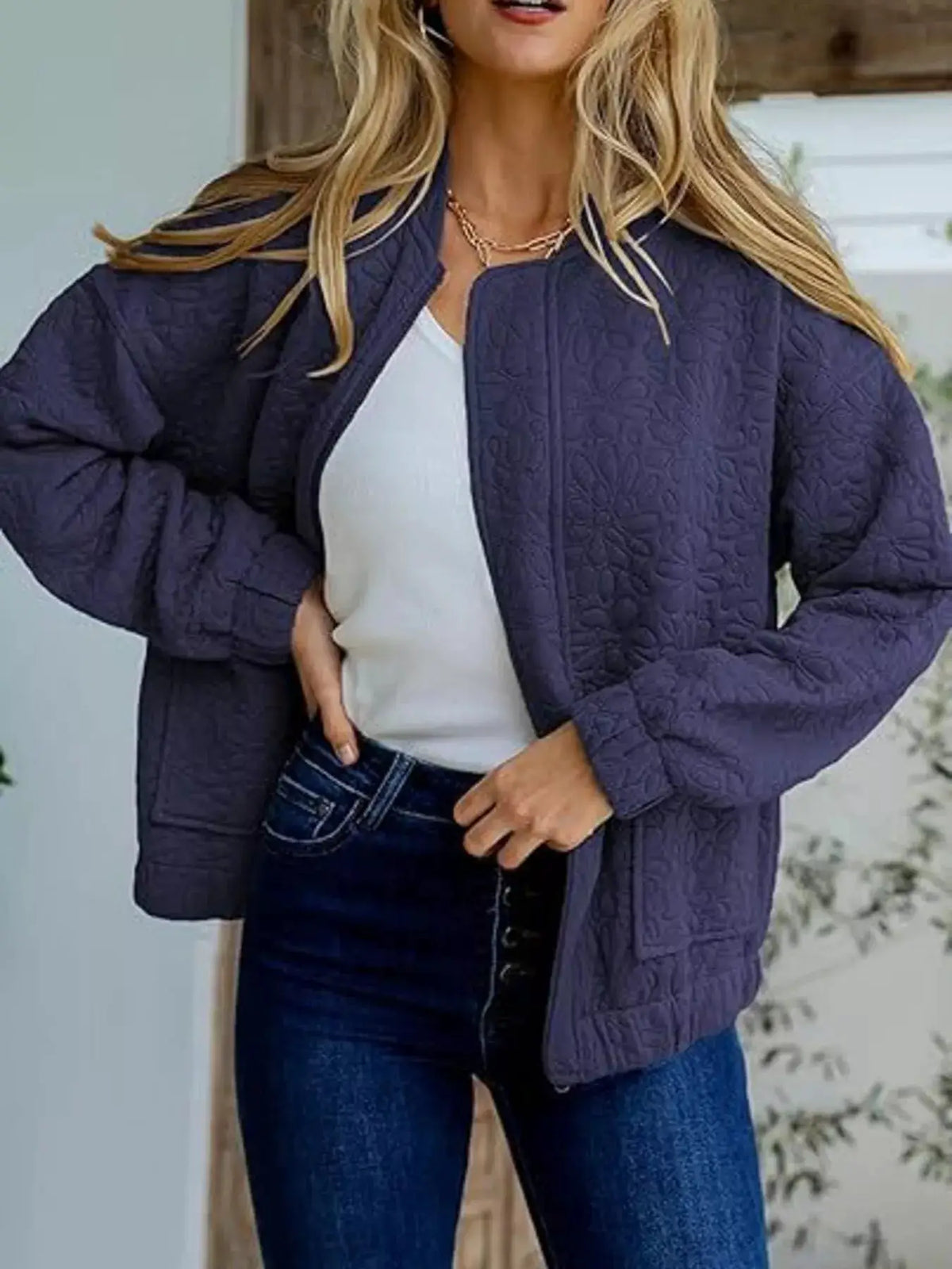 Quilted lightweight navy jacket with floral quilting, zip-up style for daily wear