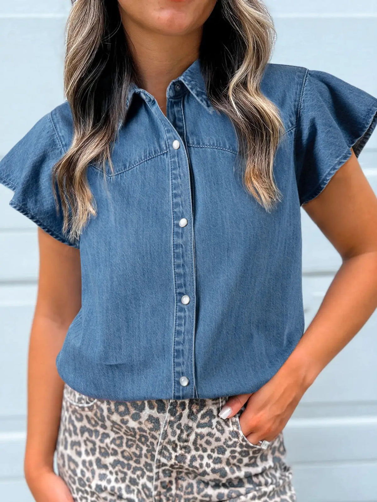 Women's ruffled short-sleeve denim button-up blouse in medium blue