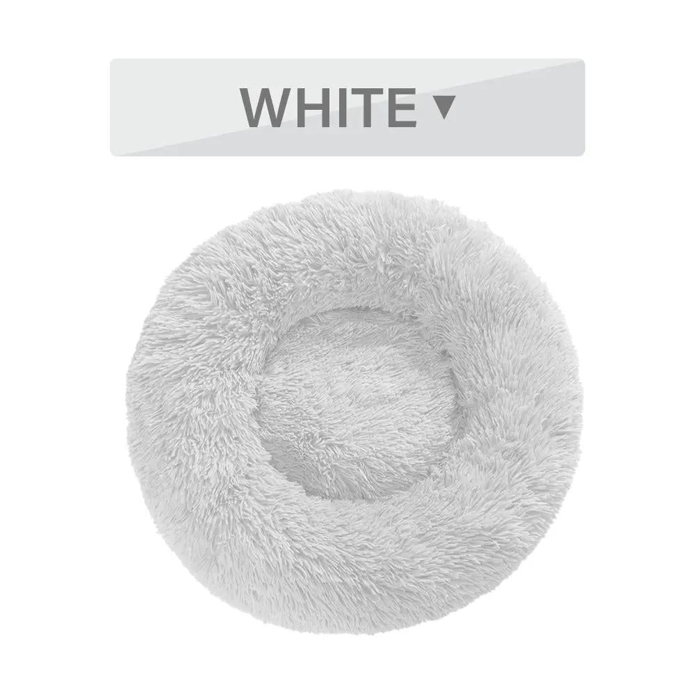Fluffy donut dog bed in white plush, round, washable pet cushion for dogs and cats.