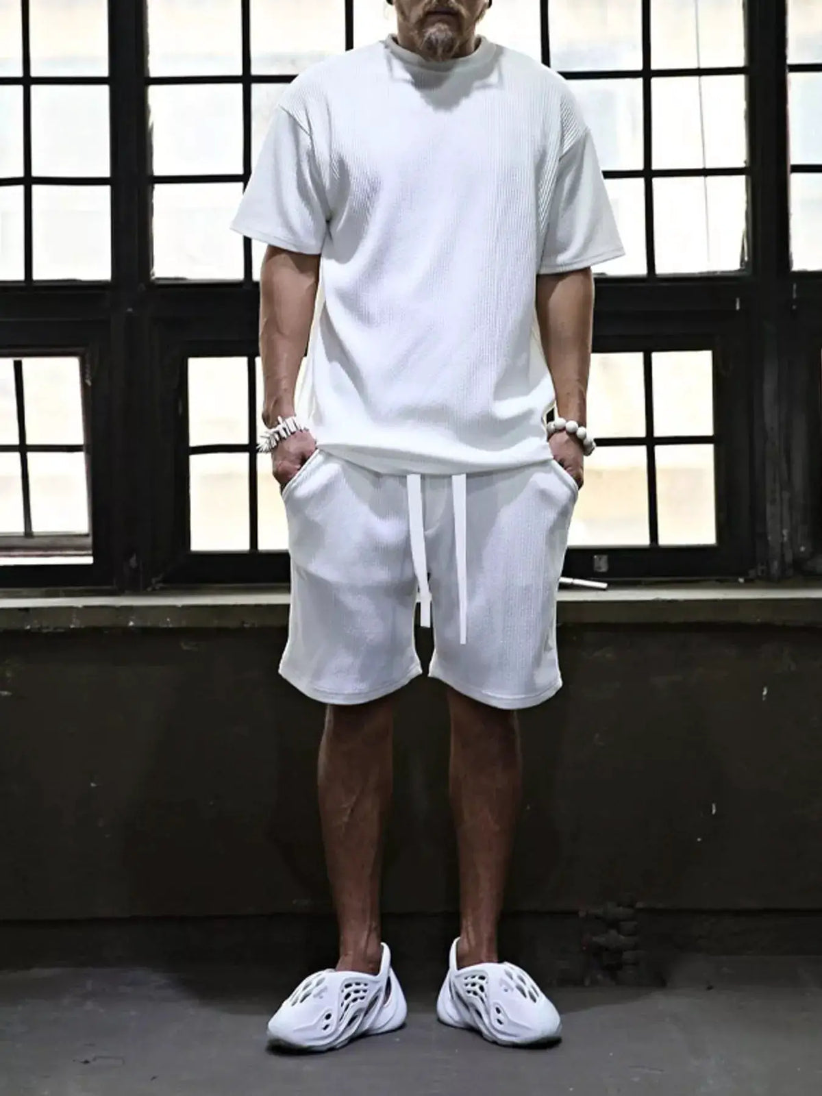 Men's white textured short-sleeve top and drawstring-pocket shorts by Trendsi