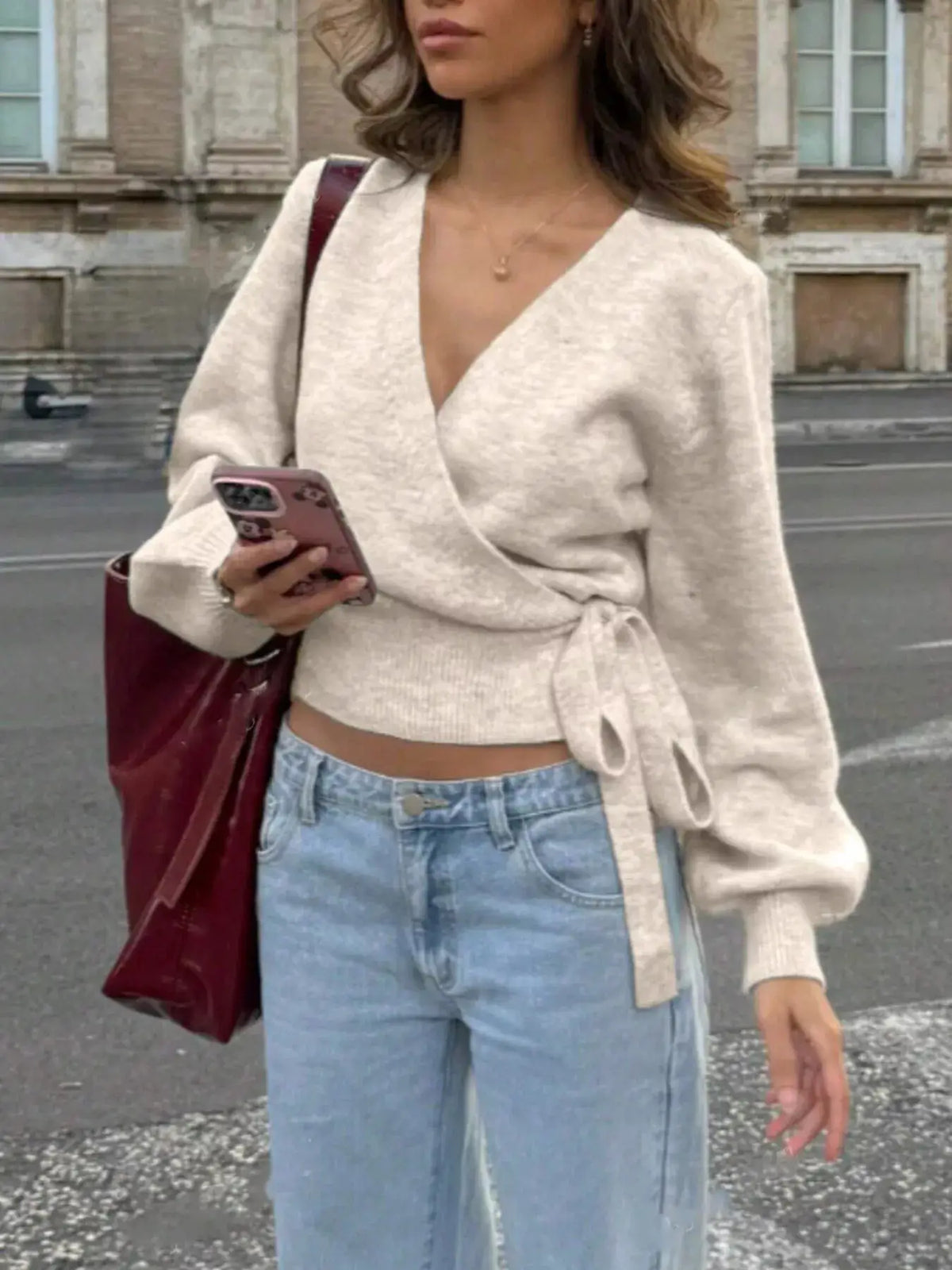 Women's tie-waist surplice sweater in cream knit with soft stretch fabric