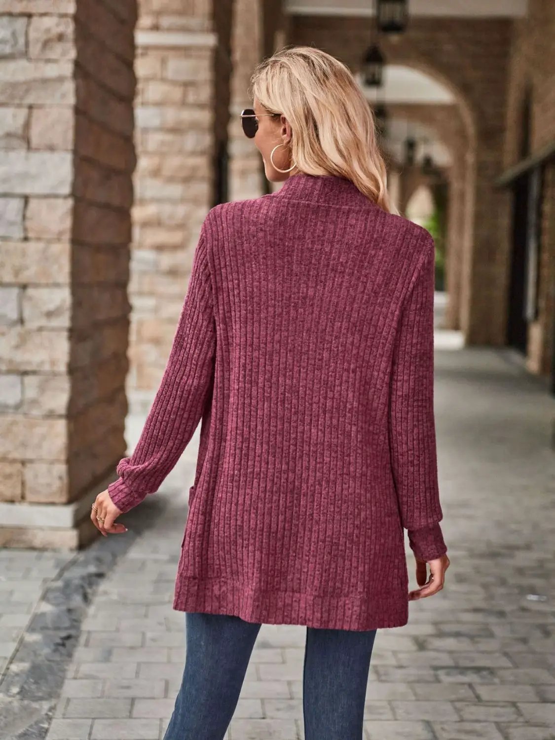 Stretchy open-front burgundy ribbed-knit cardigan, hip-length, worn with jeans