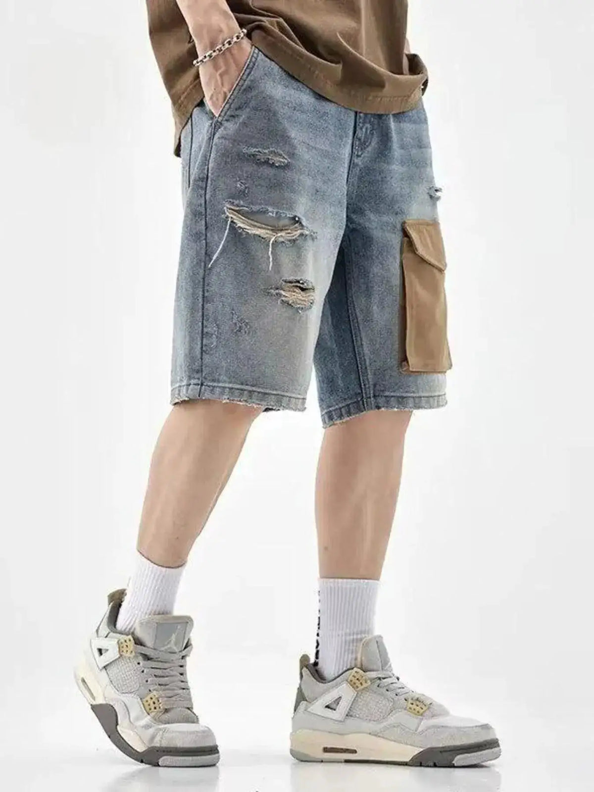 Mens distressed denim shorts with utility pockets, blue washed cotton blend