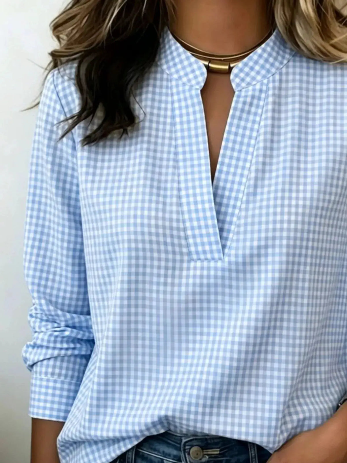 Plus-size plaid notched long-sleeve blouse in light blue gingham.