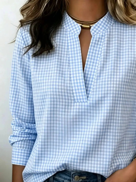 Plus-size plaid notched long-sleeve blouse in light blue gingham.