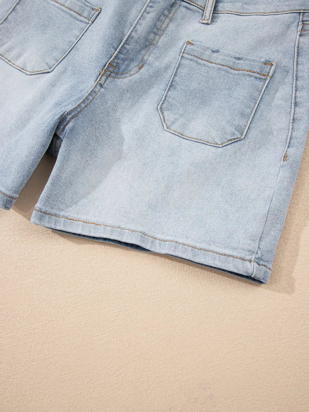 Wash High Rise Denim Shorts in light blue with back pockets