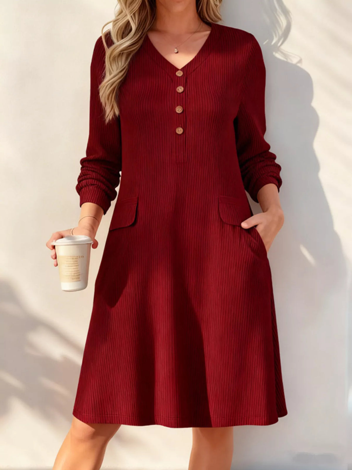 Ribbed knit V-neck dress, plus-size, with pockets and buttoned placket in burgundy by Trendsi