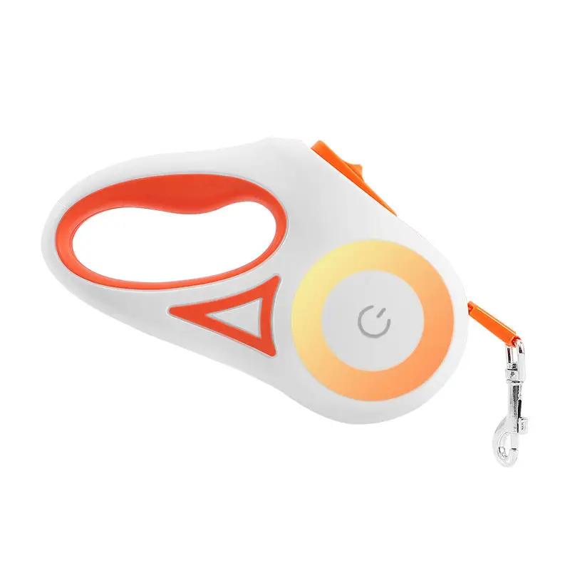 AdTec retractable dog leash with built-in spotlight, white body and orange accents, metal clip