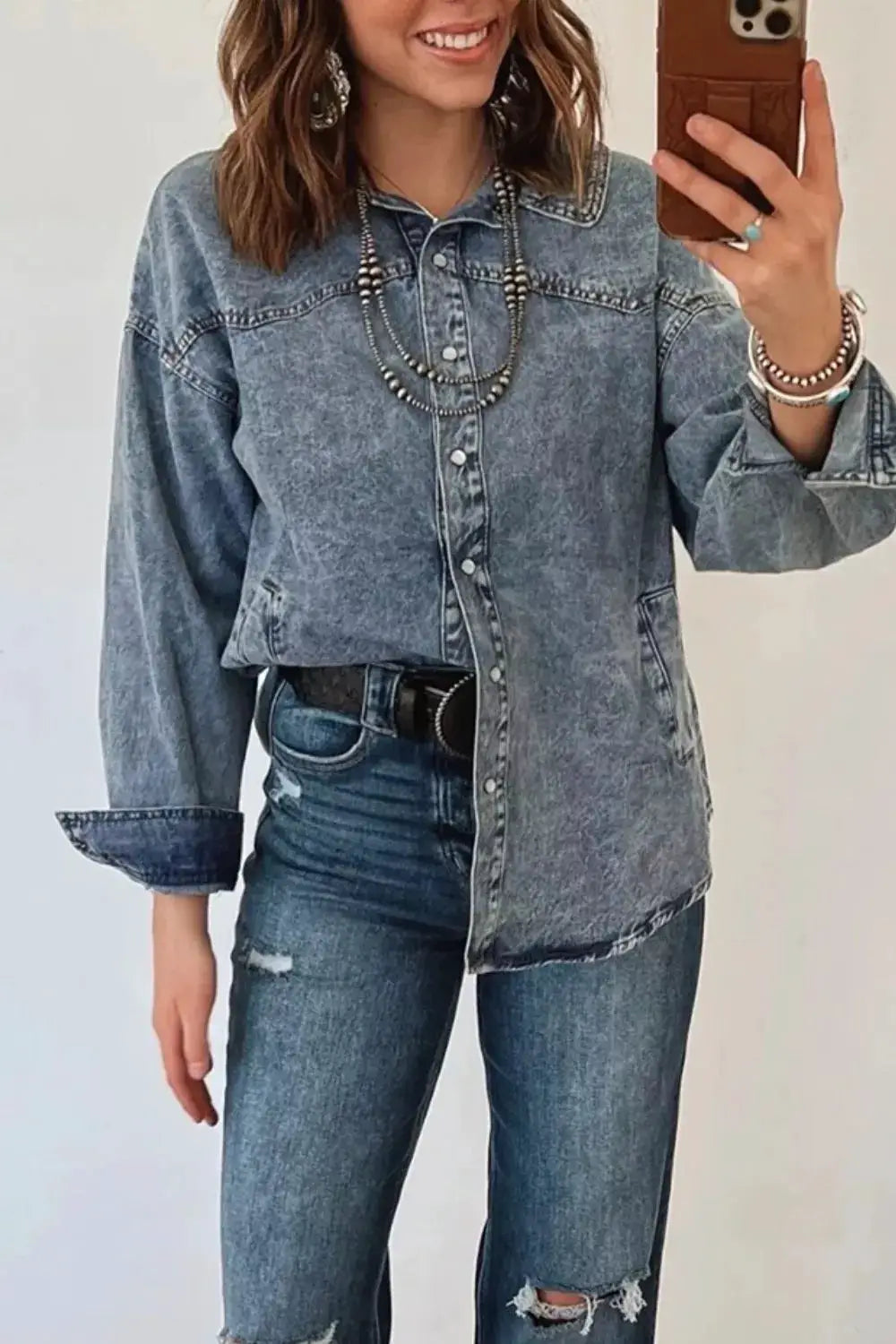 Western long-sleeve denim jacket with button placket and pockets in medium wash