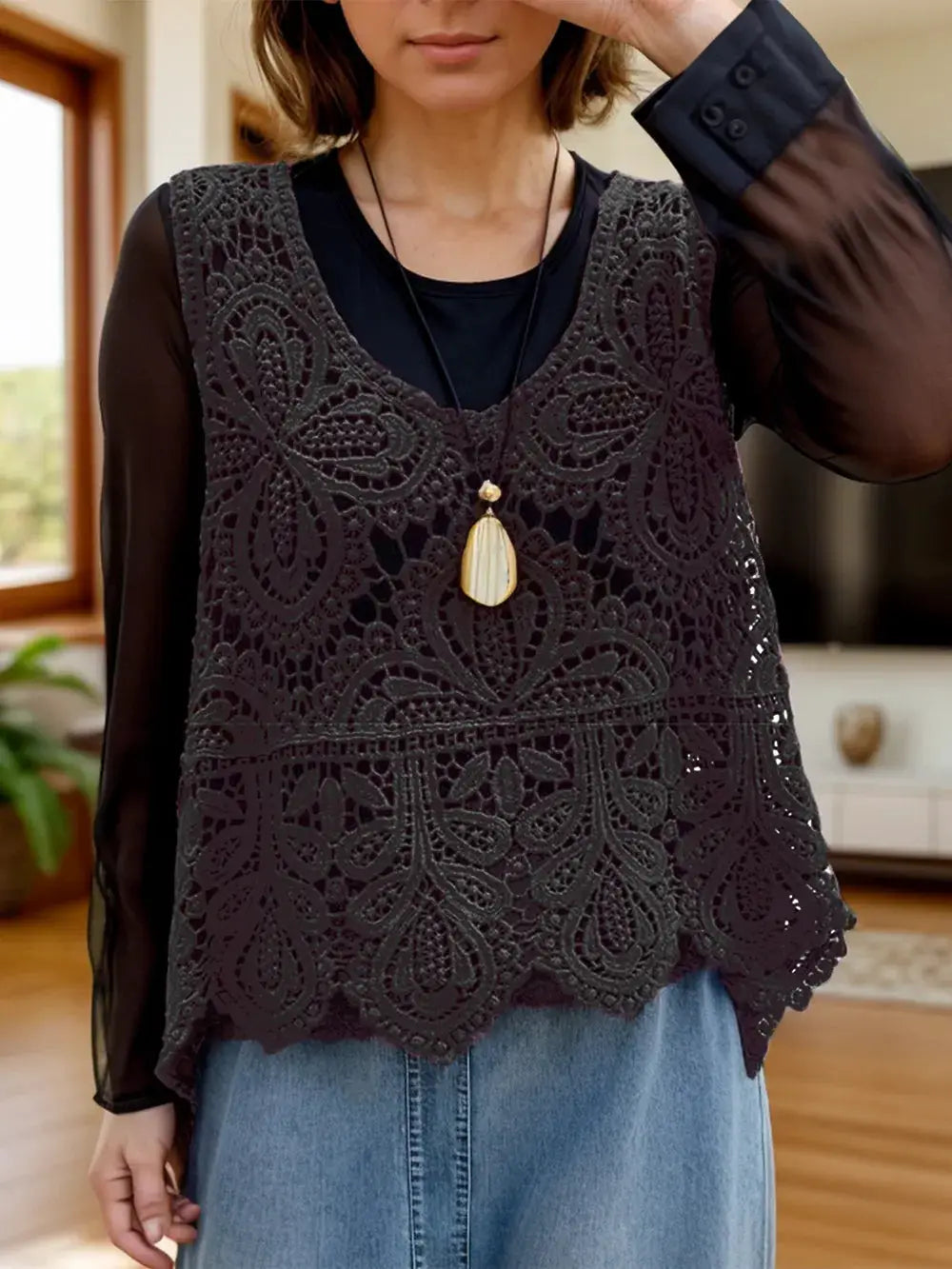 Lightweight pure cotton sleeveless scoop-neck cutout cover up in black lace, worn over a black top